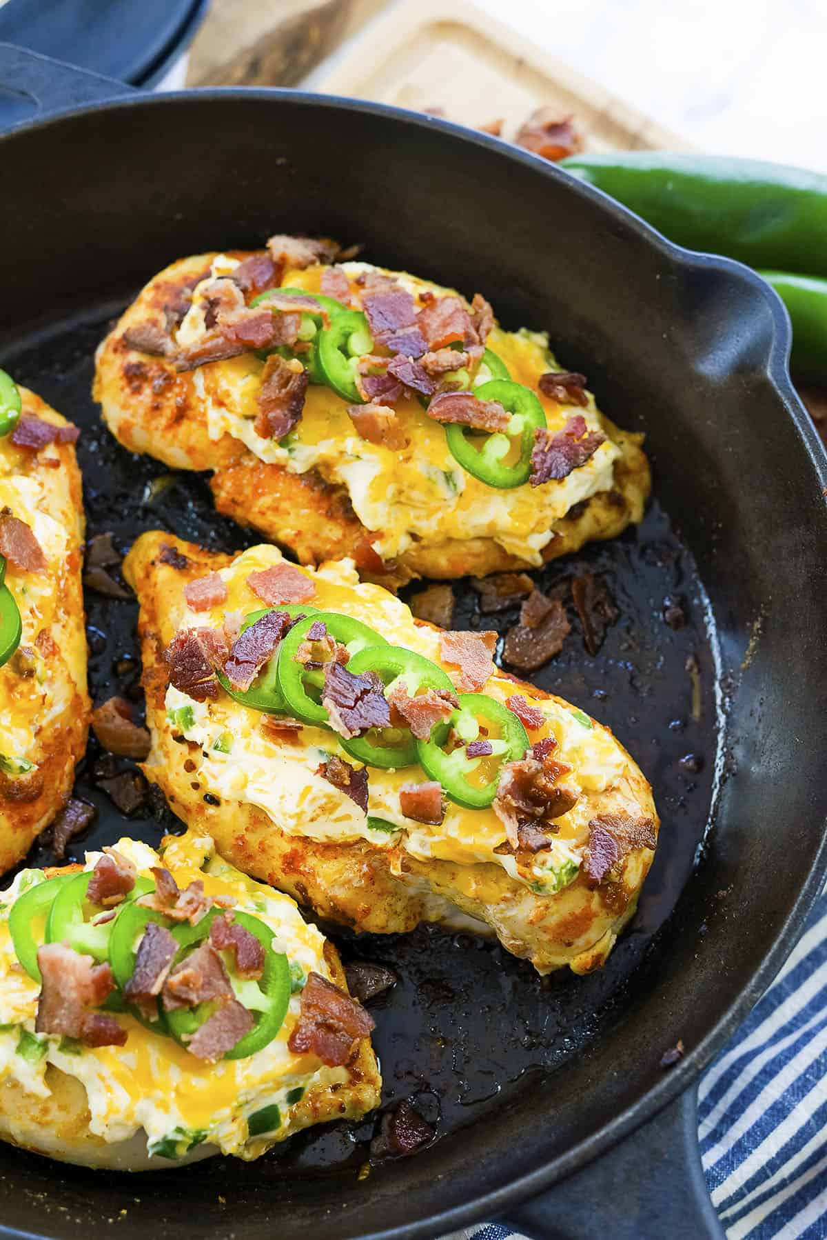 Keto jalapeno chicken in cast iron skillet.