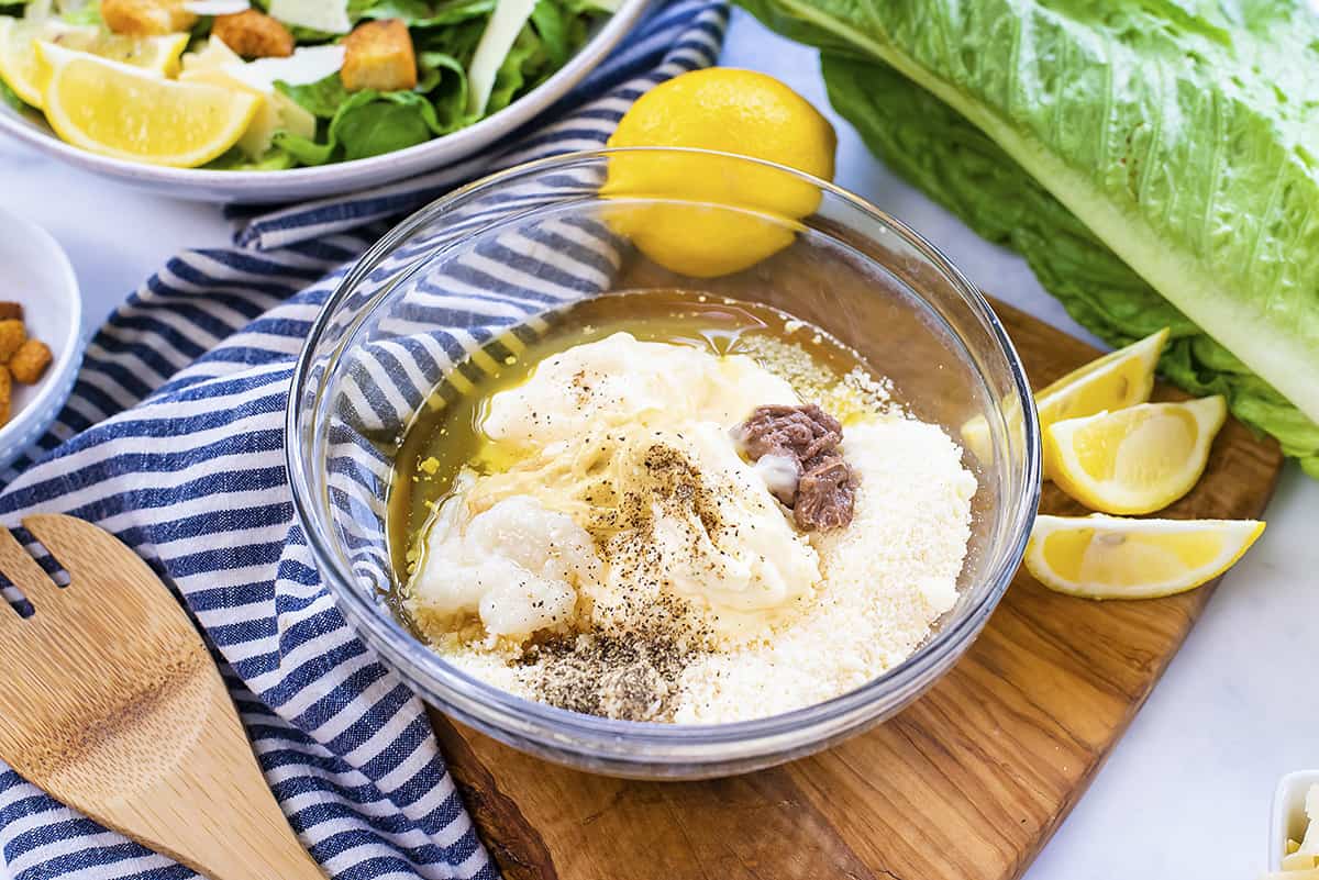 Caesar dressing ingredients in small mixing bowl.