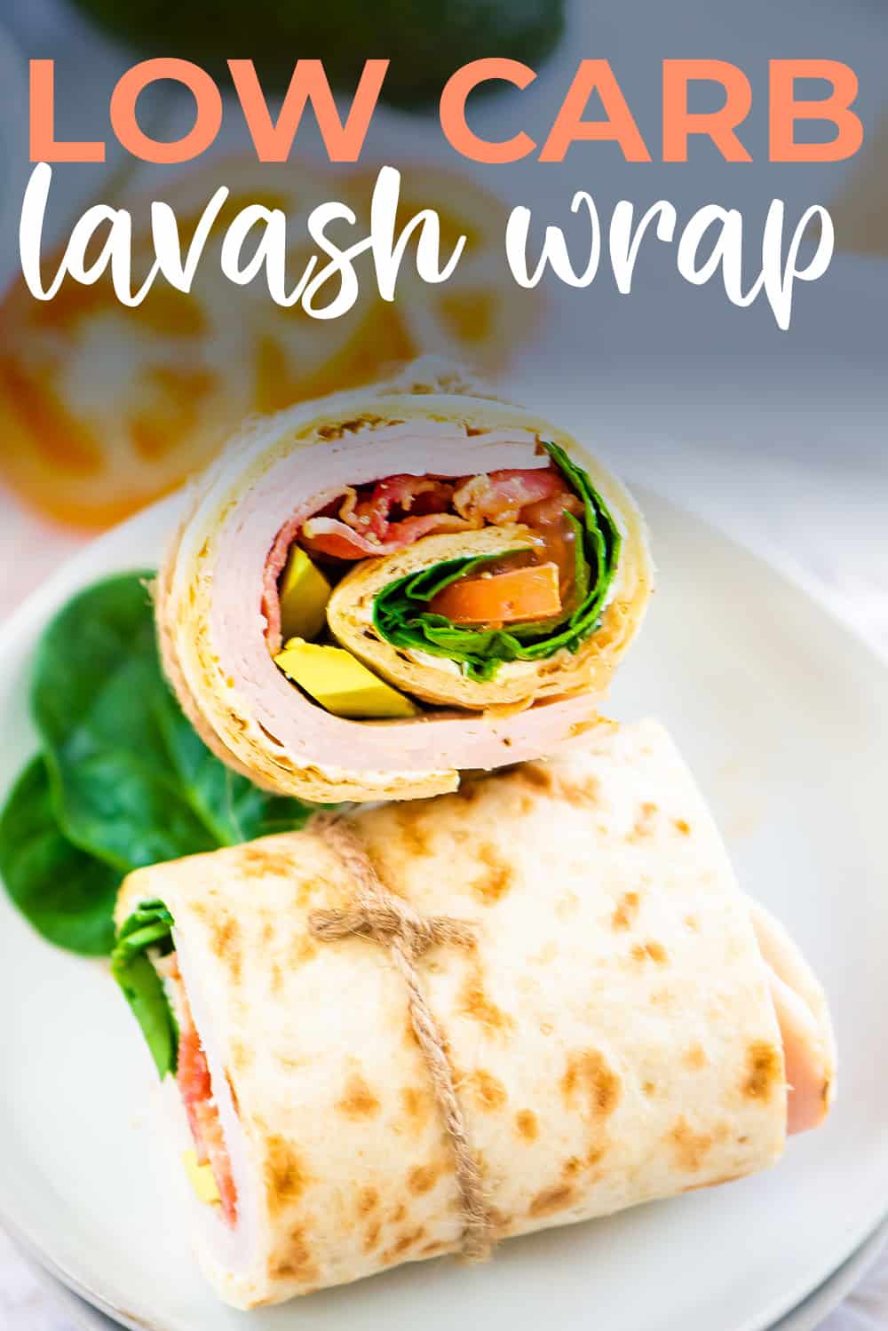 Lavash wraps cut in half and stacked on white plate.