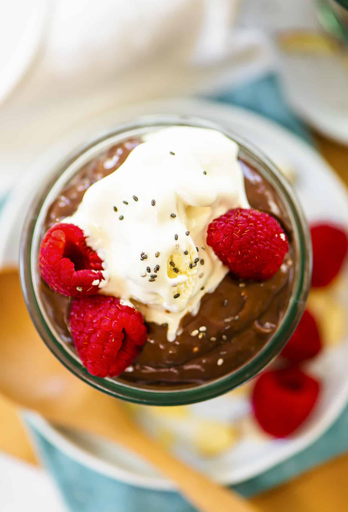 Overhead view of chocolate chia pudding in jar.