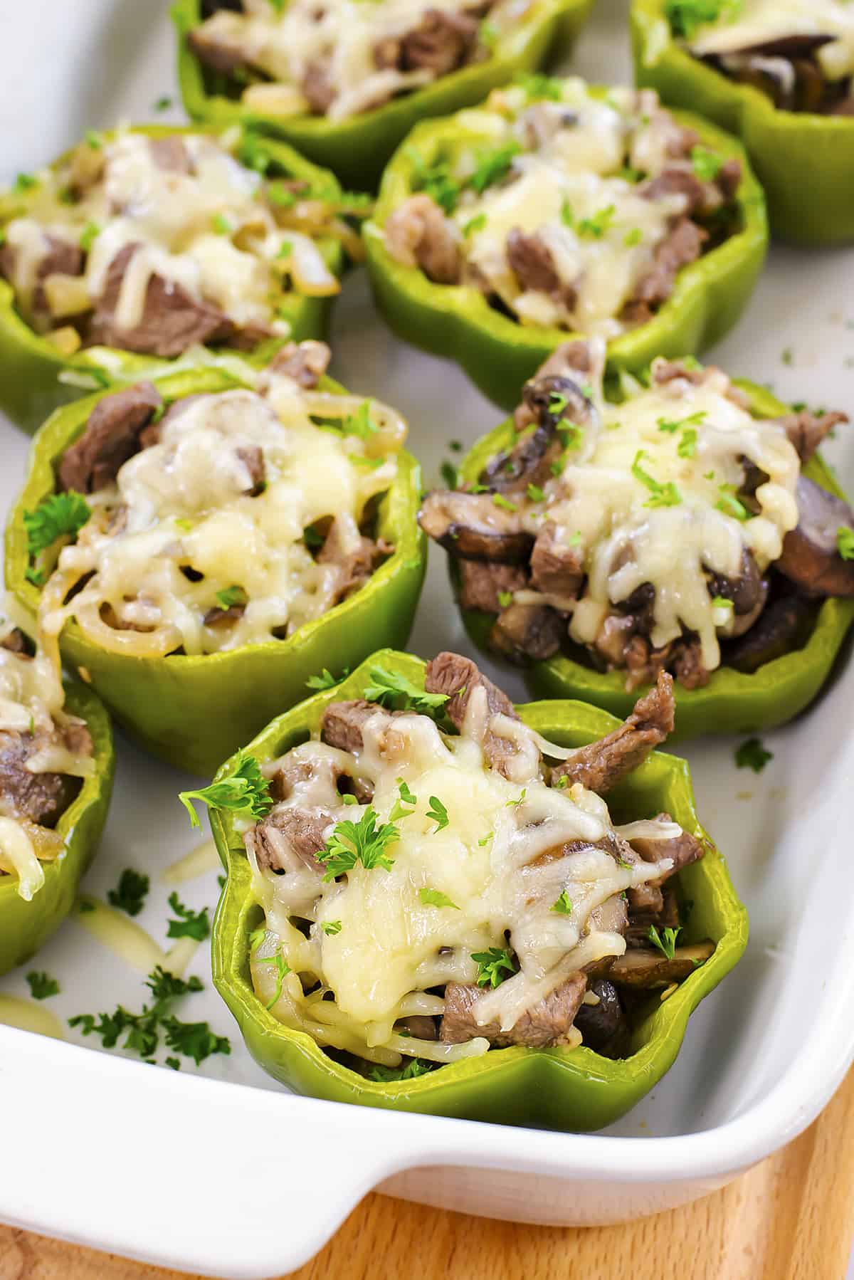Philly stuffed peppers in white baking dish.