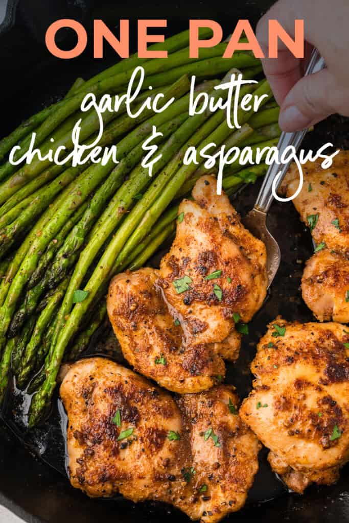 Chicken thighs and asparagus in skillet.