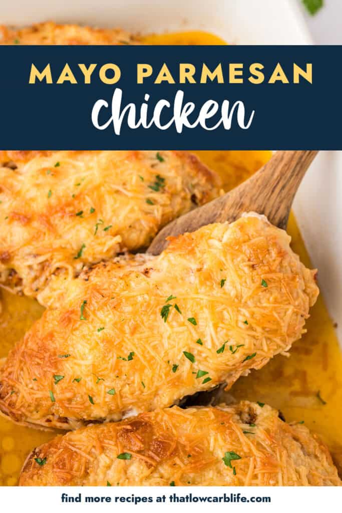 Baked chicken breasts on wooden spatula.