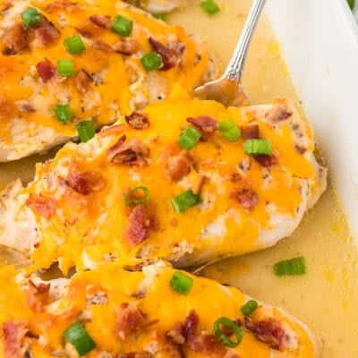 Crack chicken in white baking dish.