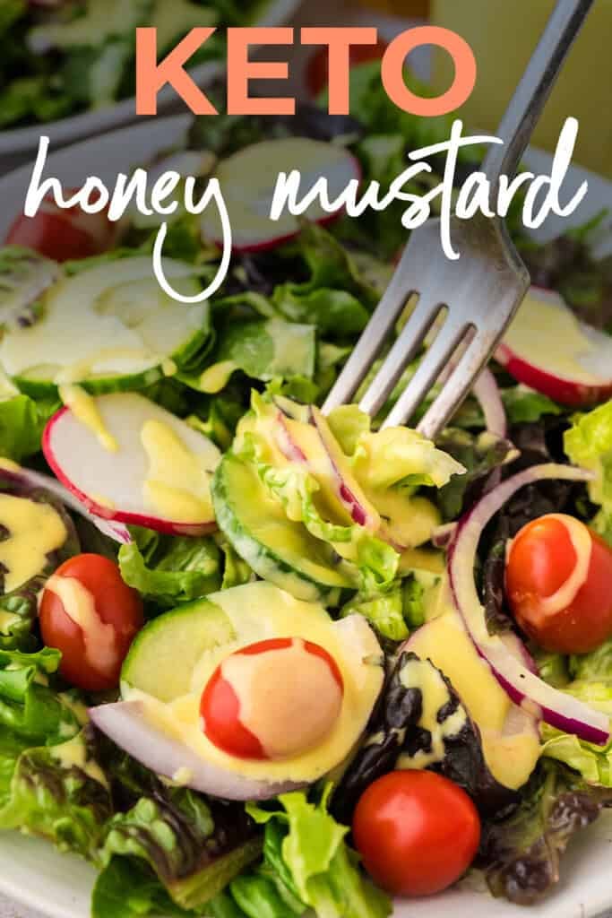 Forkful of green salad topped with our keto honey mustard dressing.