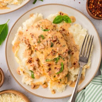 Plate topped with low carb marry me chicken and mashed cauliflower.