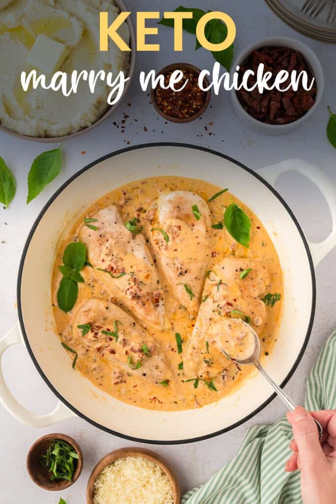 Skillet full of chicken in cream sauce.