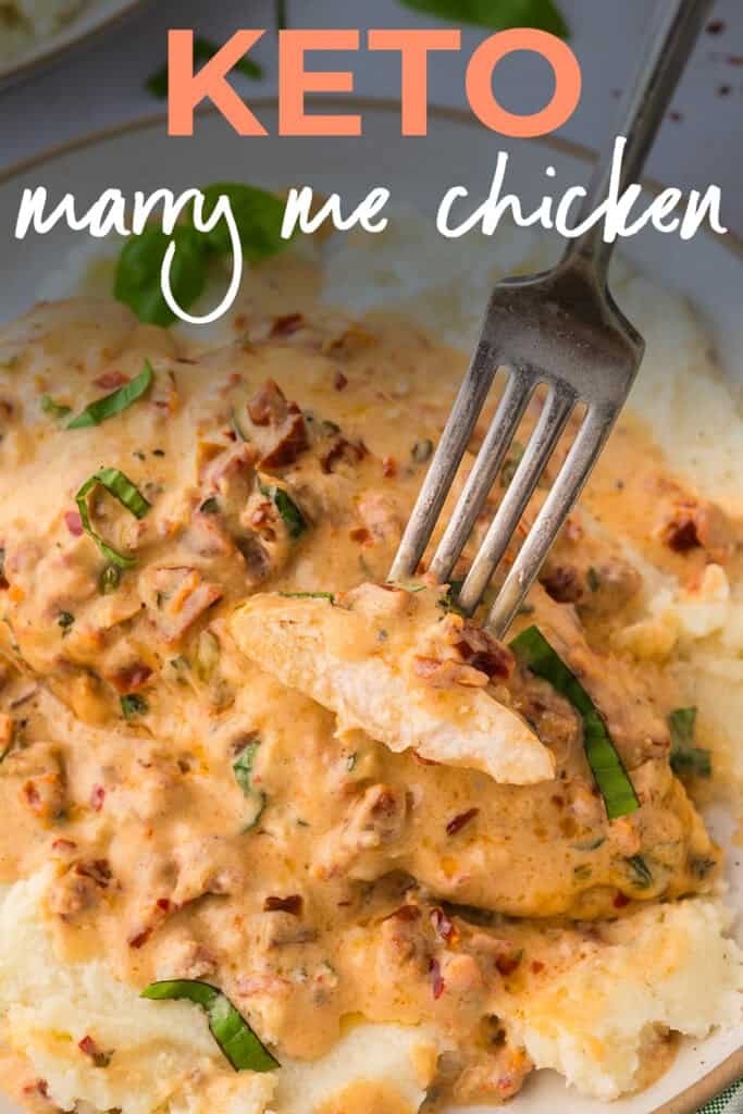 Slice of chicken coated in parmesan cream sauce.