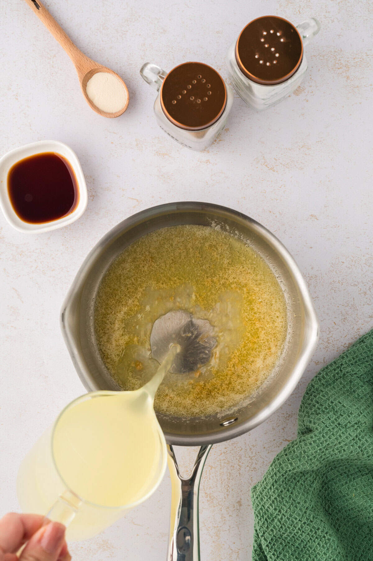Liquid being added to pot.