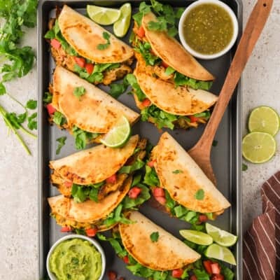 Baked chicken tacos on sheet pan.