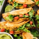 Keto chicken tacos on baking sheet.
