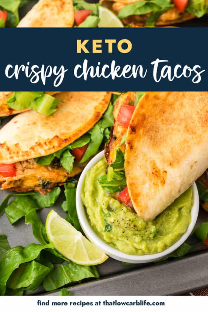 Baked chicken tacos being dipped in guacamole.