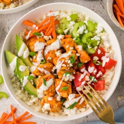 Overhead view of buffalo chicken bowl with fork.