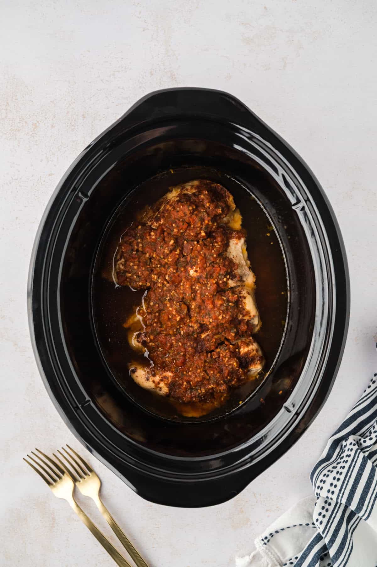 Cooked crockpot salsa chicken.