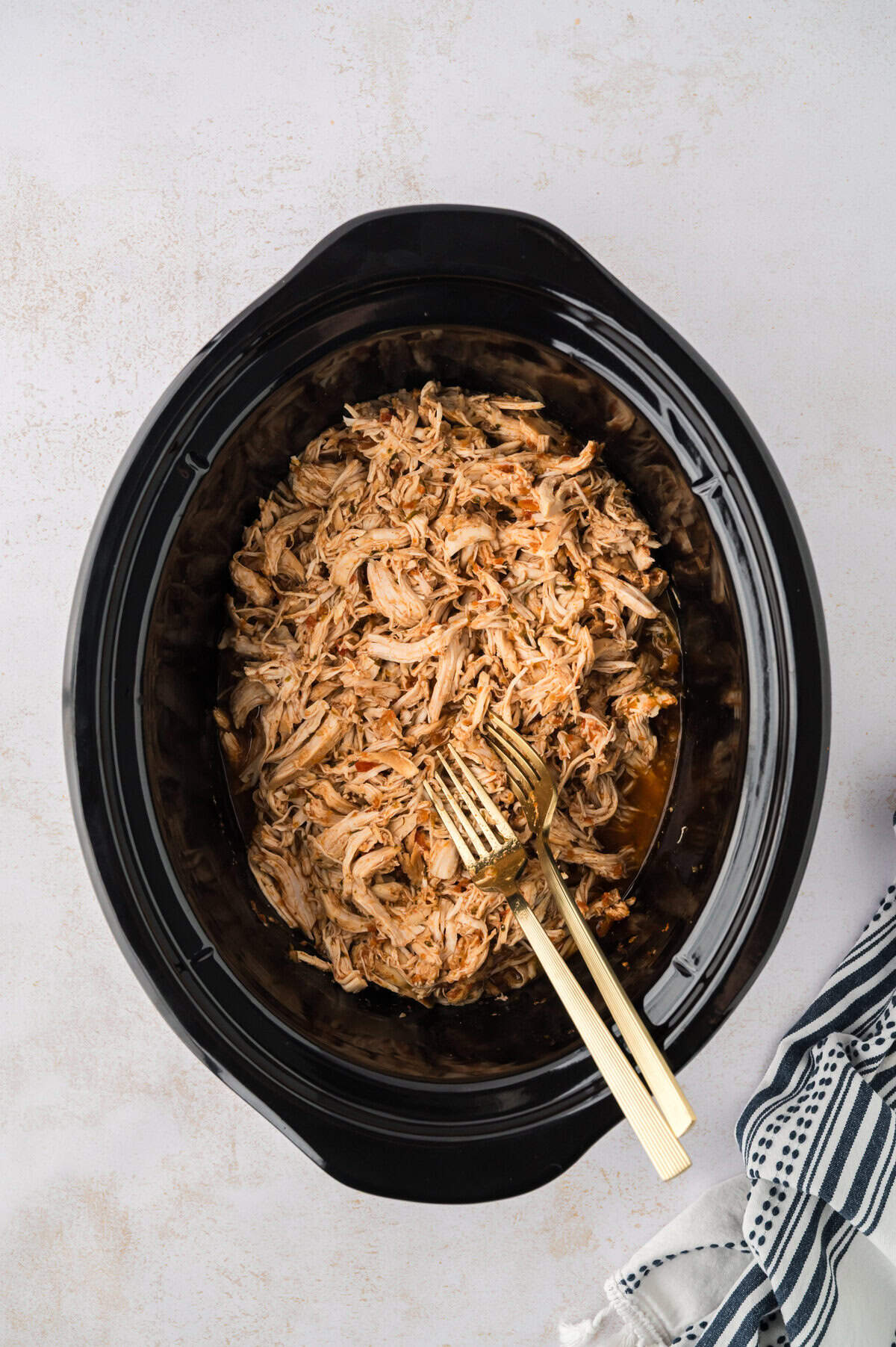 Shredded salsa chicken in crockpot.