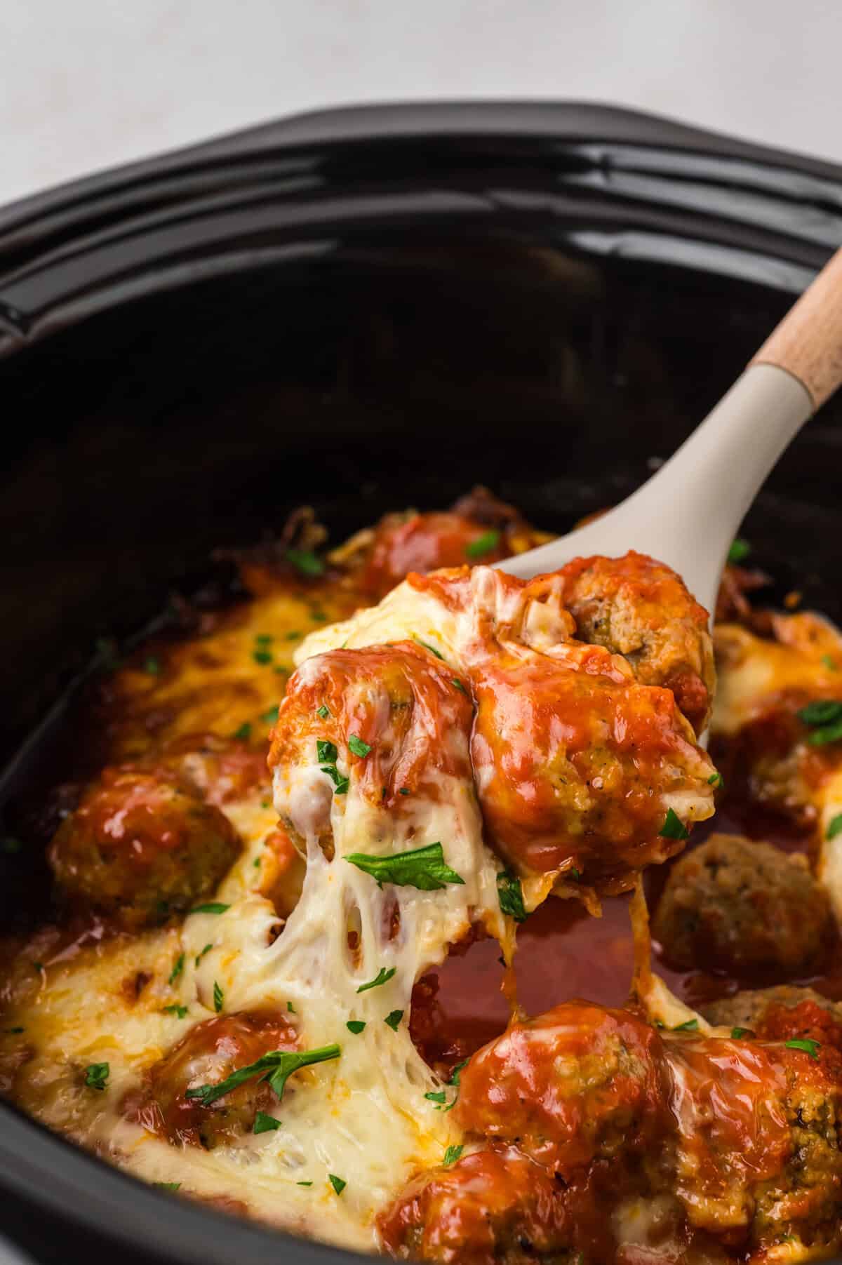 Low carb meatball casserole in slow cooker.