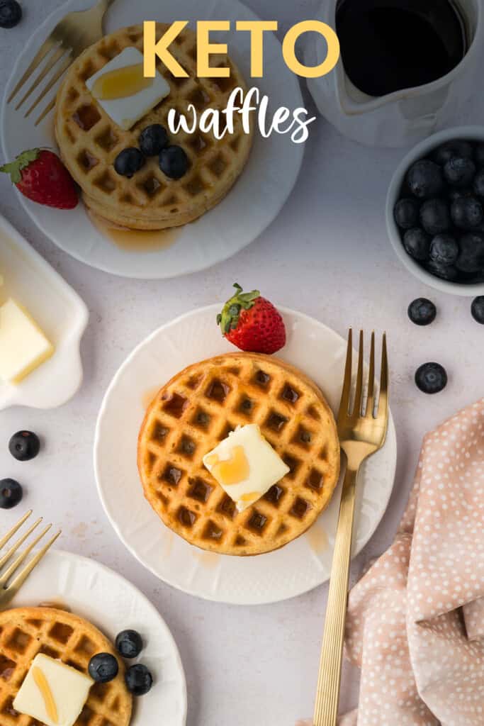 Overhead view of low carb waffles on white plates.