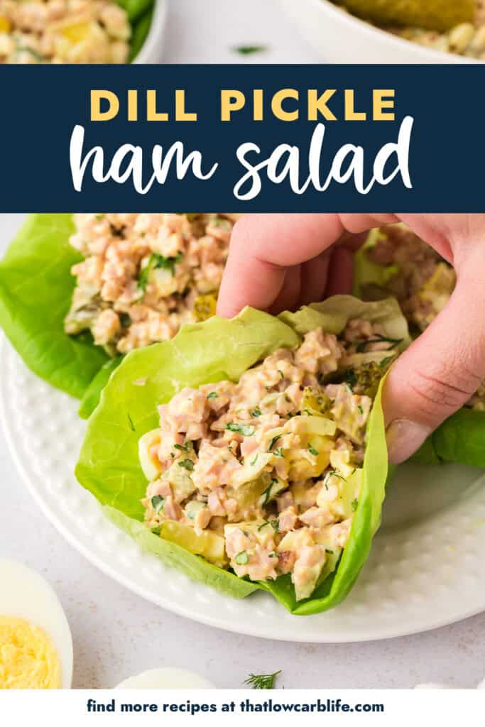 Hand grabbing a ham salad lettuce wrap.