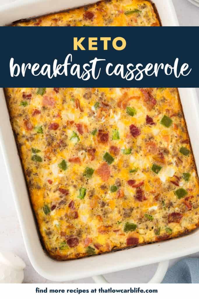 Breakfast casserole with sausage and bacon in white dish.