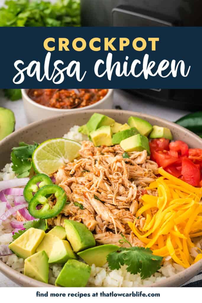 Bowl full of crockpot salsa chicken, cauliflower rice, and toppings.