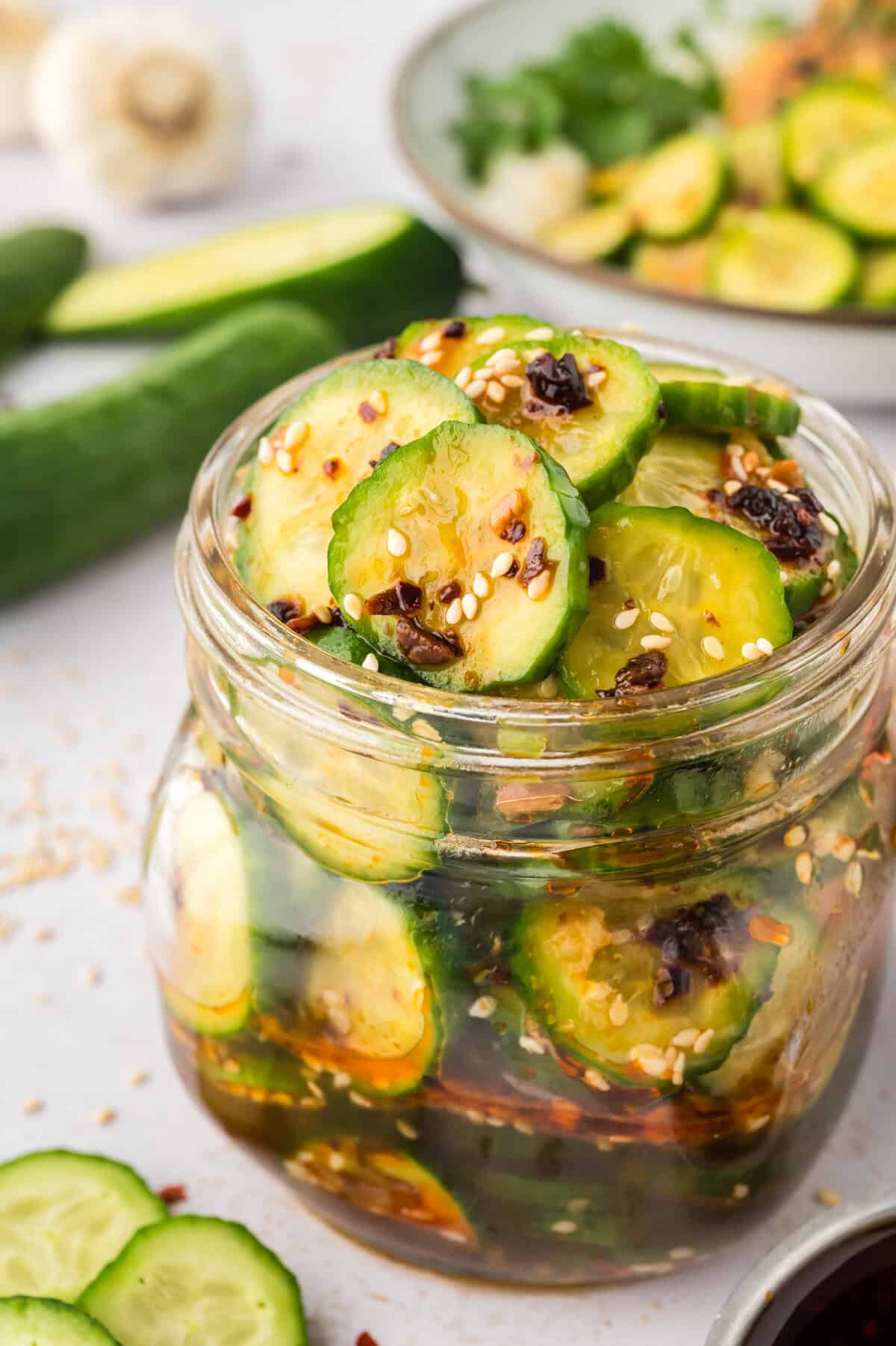 Asian cucumber salad in small jar.