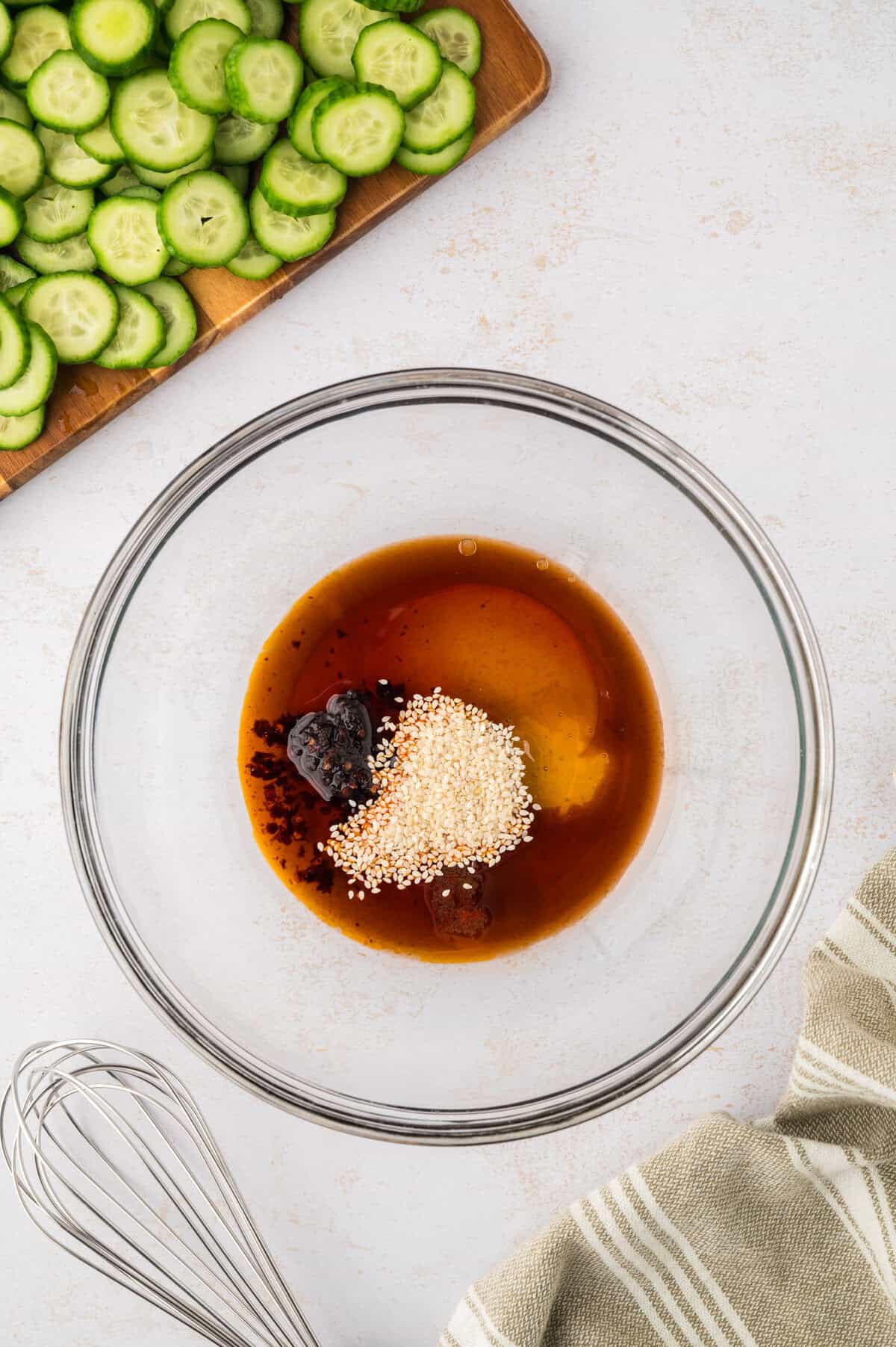 Dressing for Asian cucumber salad in mixing bowl.