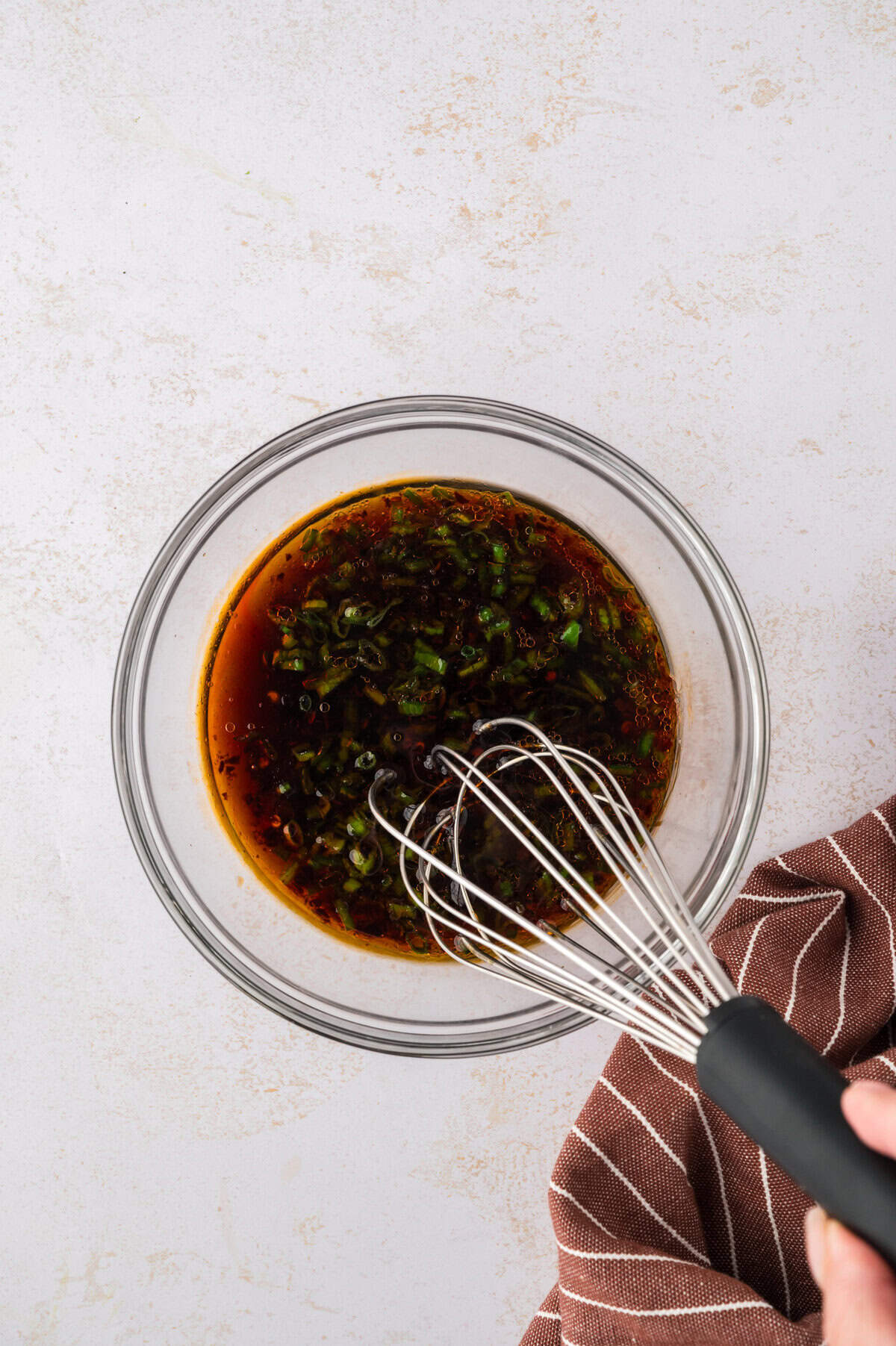 Sauce being whisked together.