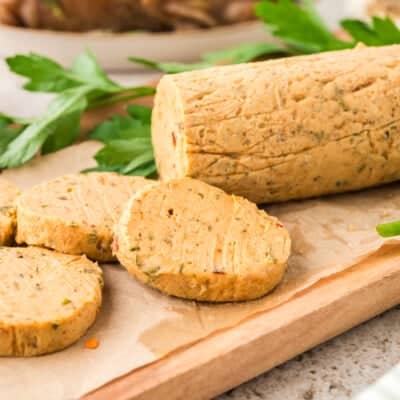 Sliced cowboy butter on cutting board.