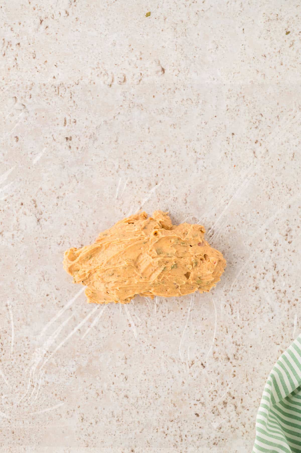 Cowboy butter on piece of plastic wrap.