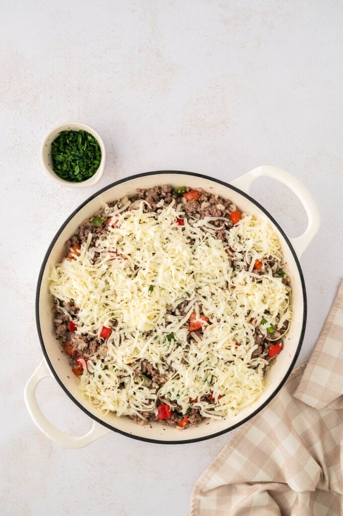 Cheese on top of keto stuffed pepper skillet recipe.