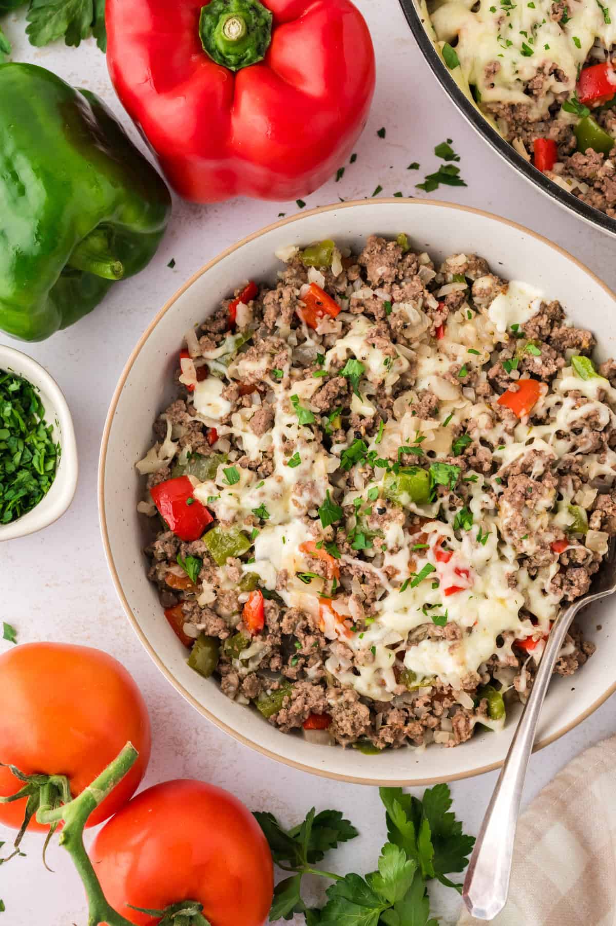 Keto stuffed pepper skillet in white skillet.