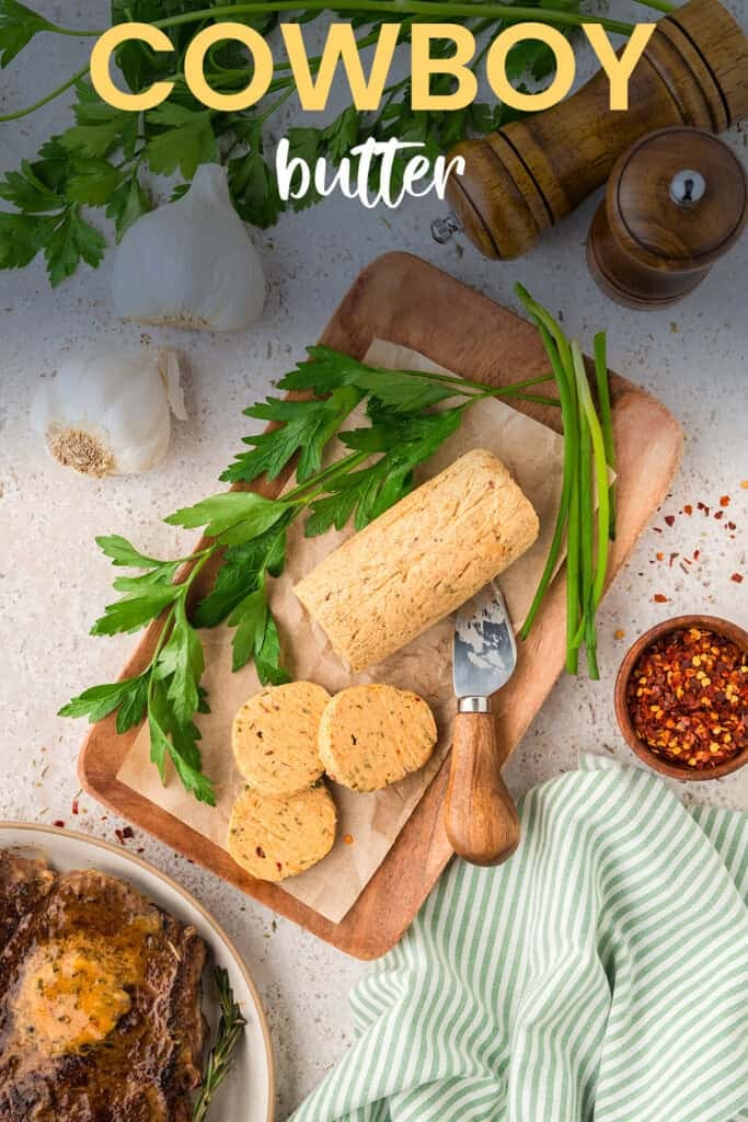 Sliced cowboy butter on wooden board.