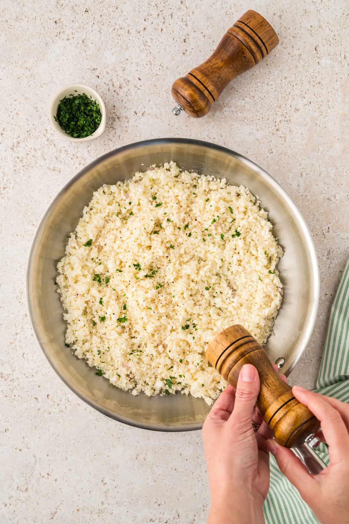 Cauliflower rice pilaf in skillet.