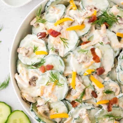 Overhead view of cucumber ranch crack salad recipe in white dish.