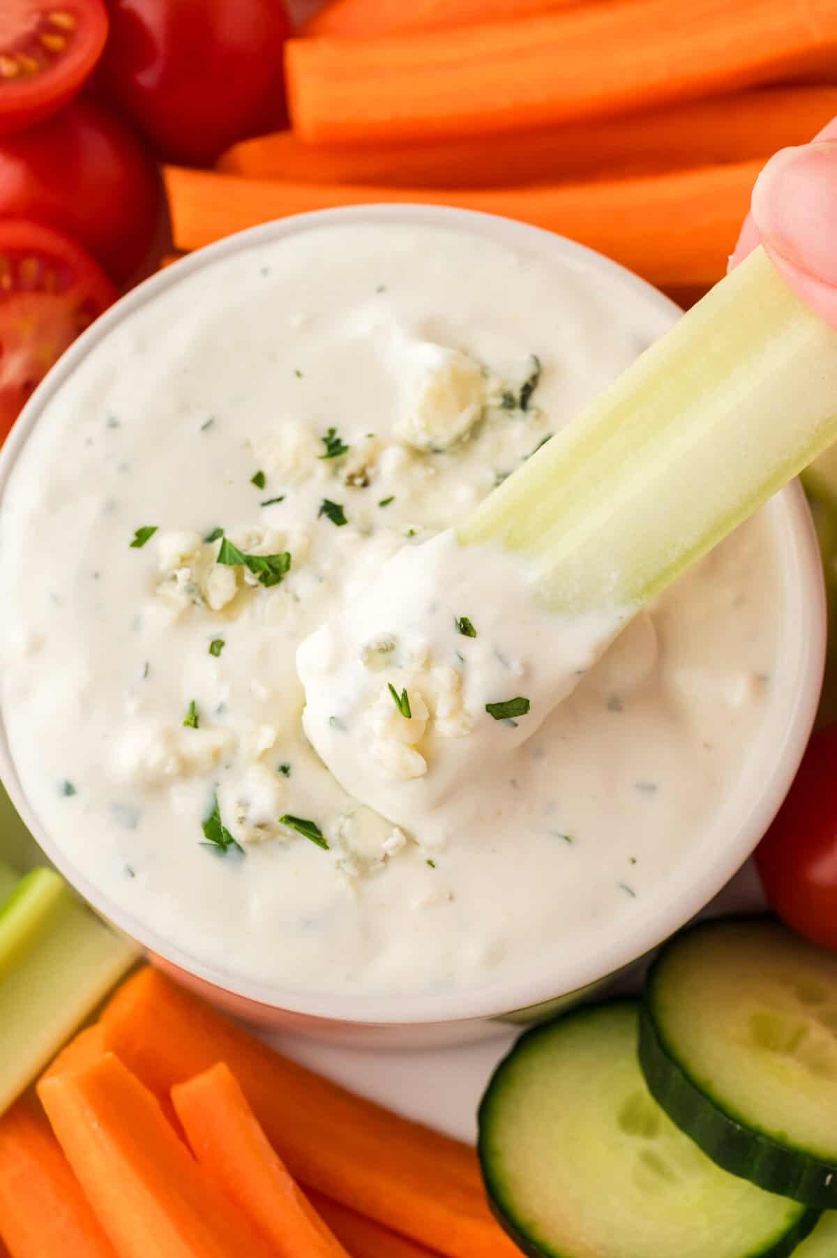 Celery stick dipped in keto blue cheese dressing recipe.