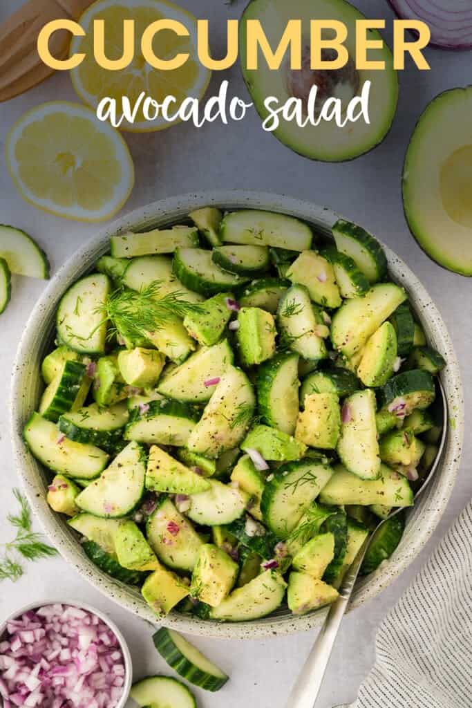 Overhead view of cucumber avocado salad in bowl.