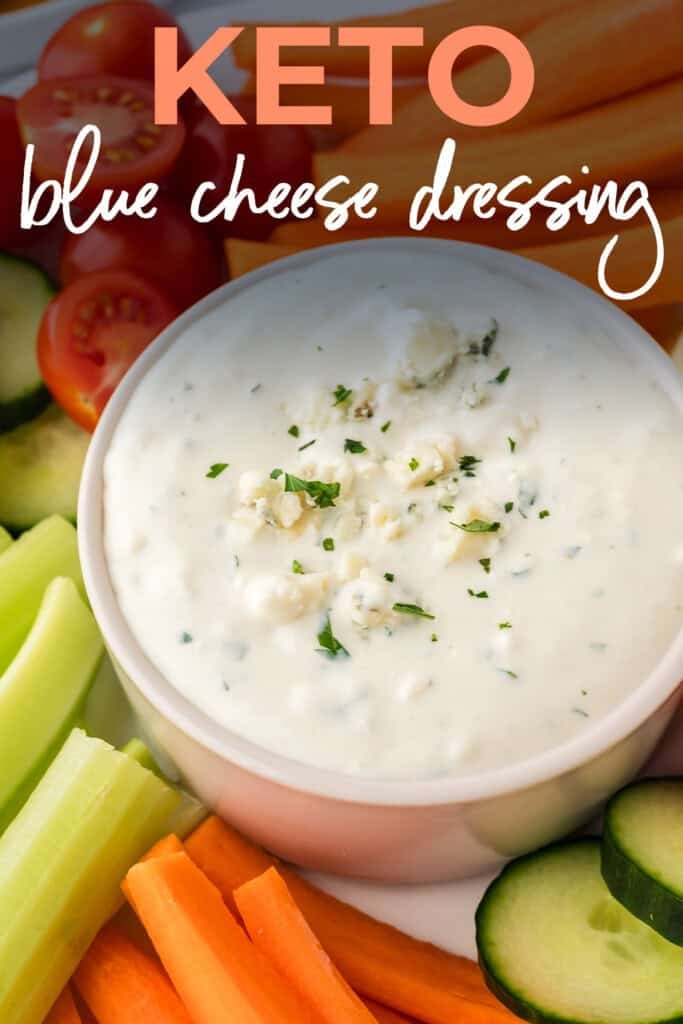 Keto blue cheese dressing in bowl surrounded by veggies.