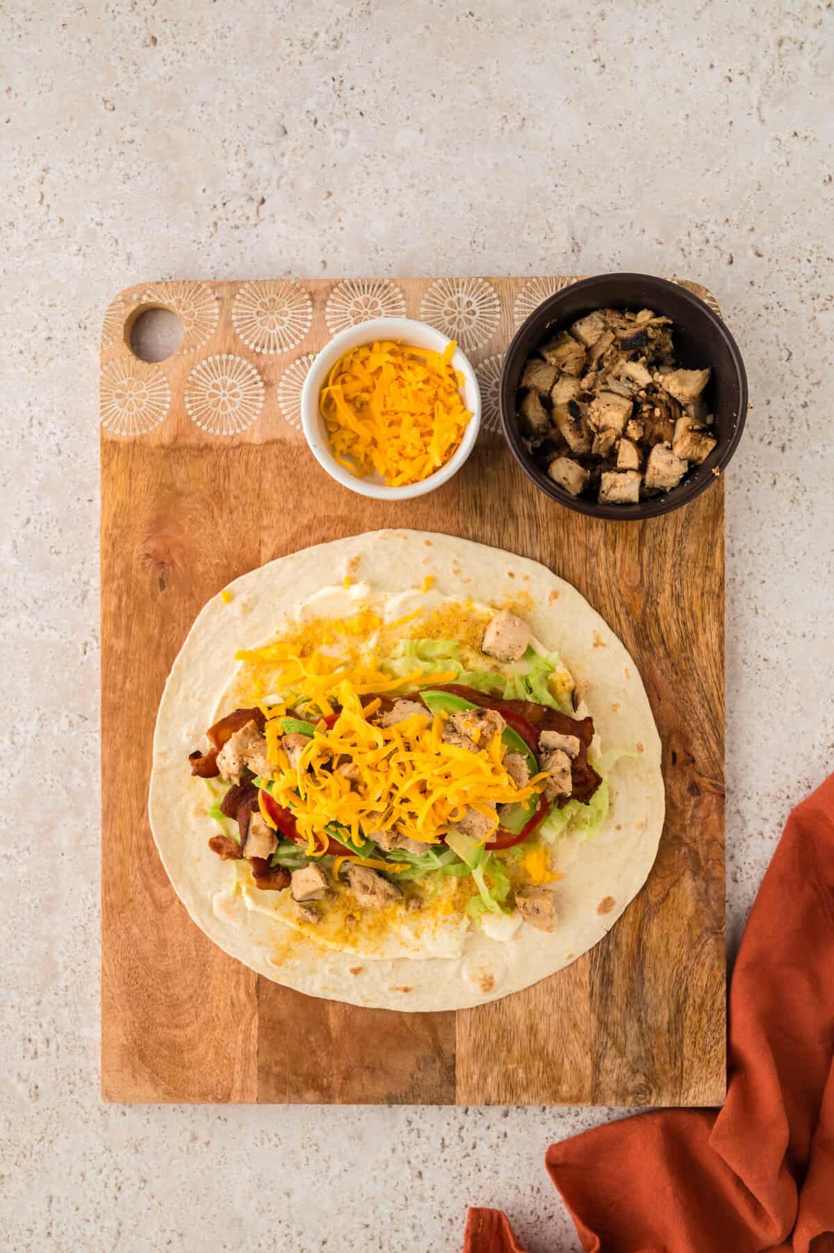 Filling added to tortilla wrap.