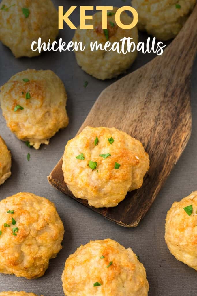 Browned chicken meatballs on baking sheet.