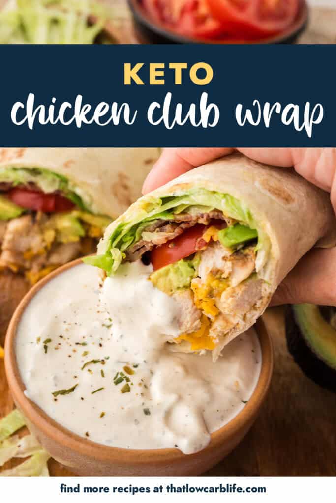 Chicken club wrap being dipped in ranch.