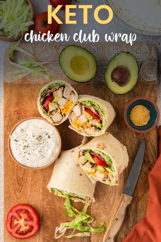 Chicken club wraps on cutting board.