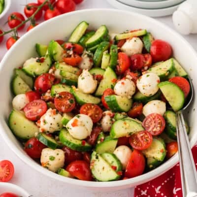 White bowl filled with cucumber tomato salad recipe.
