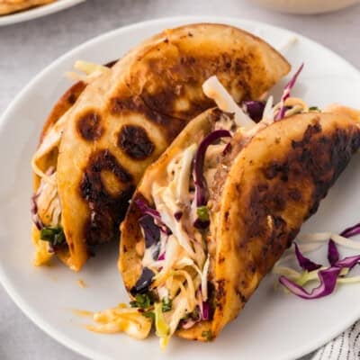 Smashed egg roll tacos on plate.