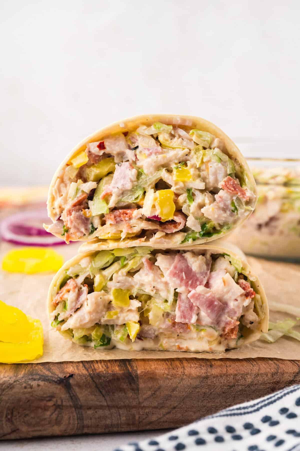Italian grinder wrap cut in half and stacked together.