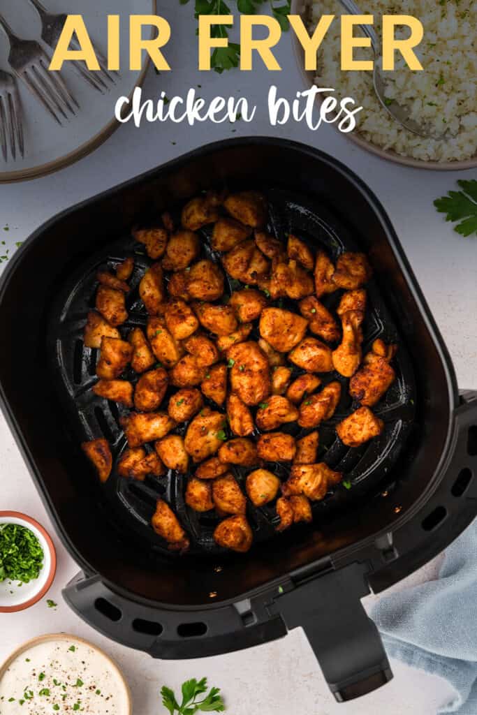 Air fryer basket full of low carb chicken bites.