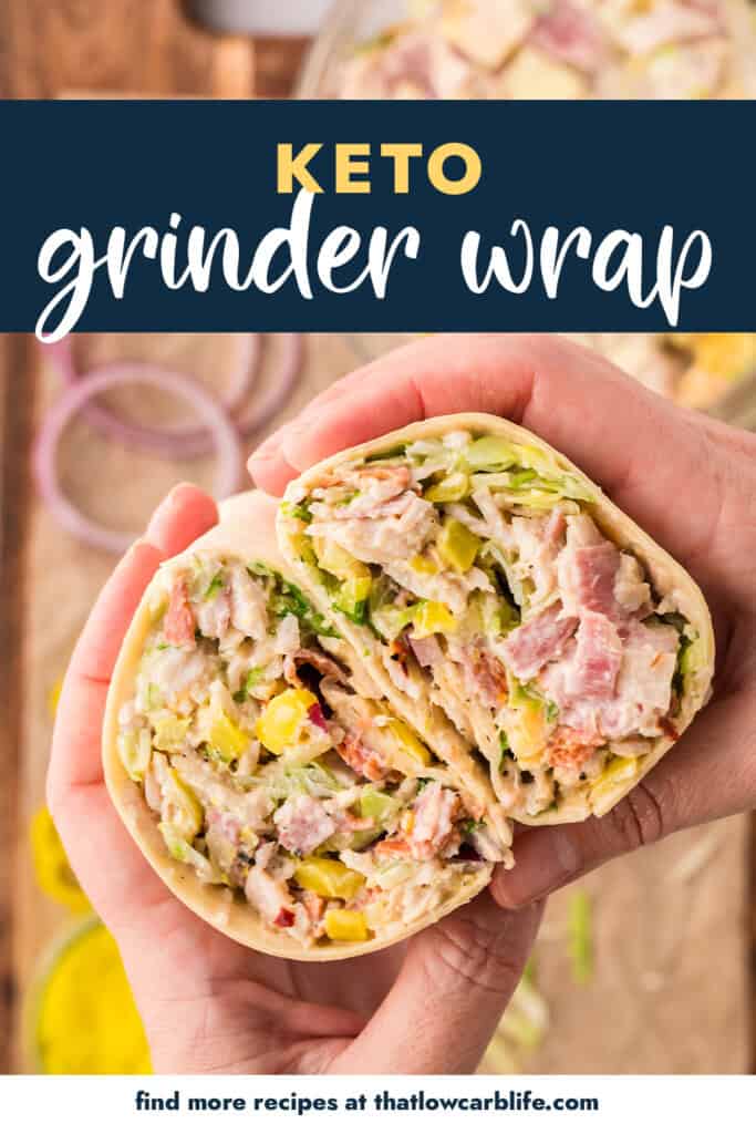 Hands holding a wrap cut in half.