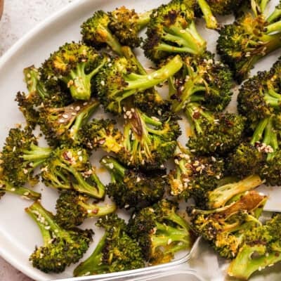 Plate full of Asian roasted broccoli.