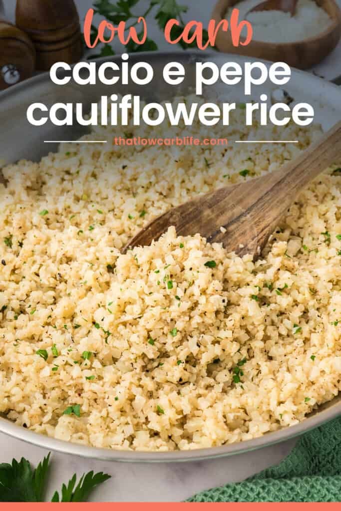 Cauliflower rice in skillet with wooden spoon.