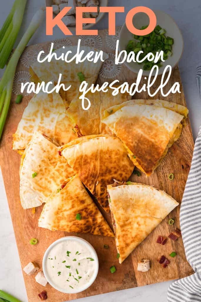 Wedges of quesadilla on cutting board.